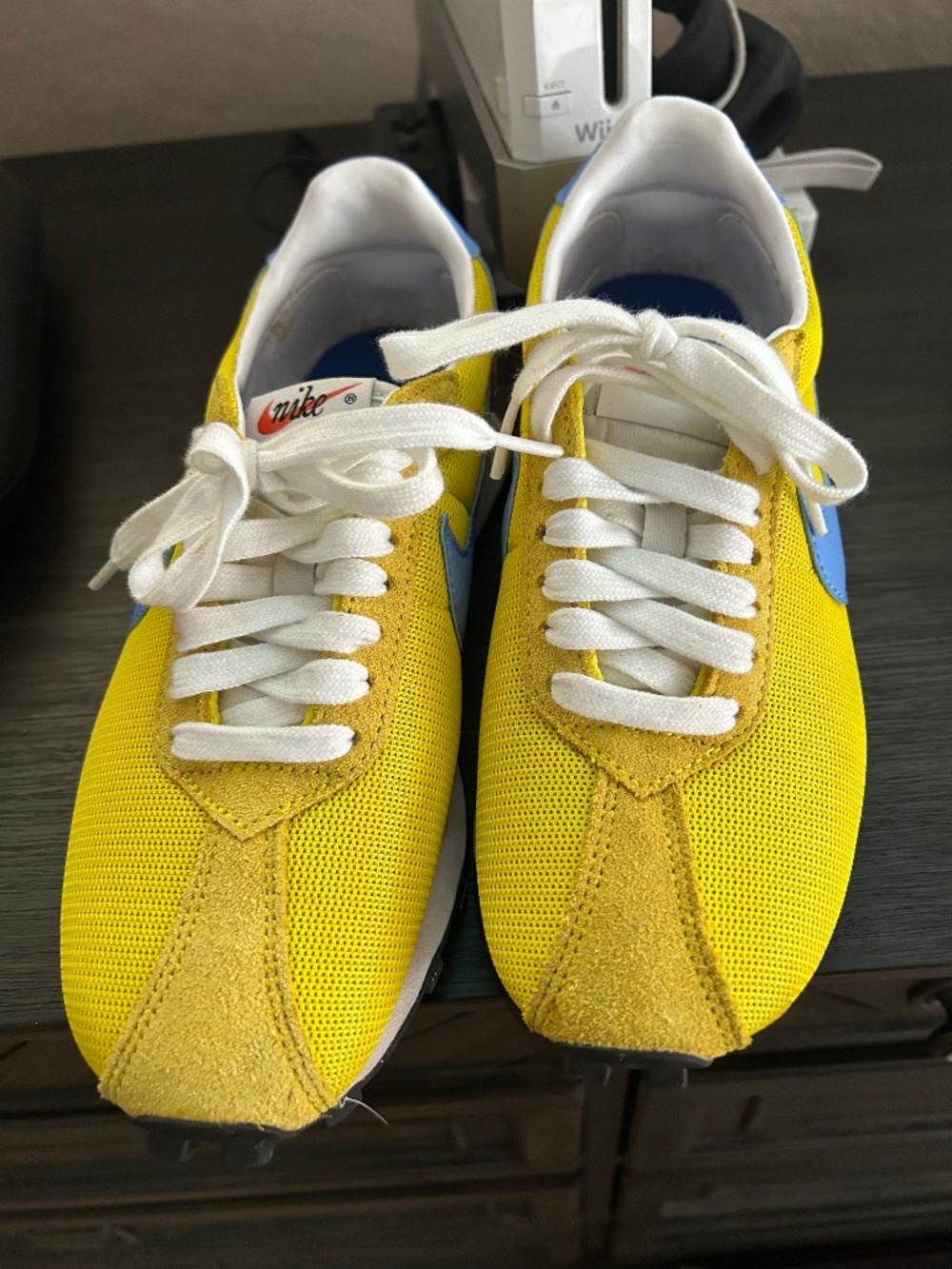 Blue and yellow Nike sneakers vintage look like you or once around the house